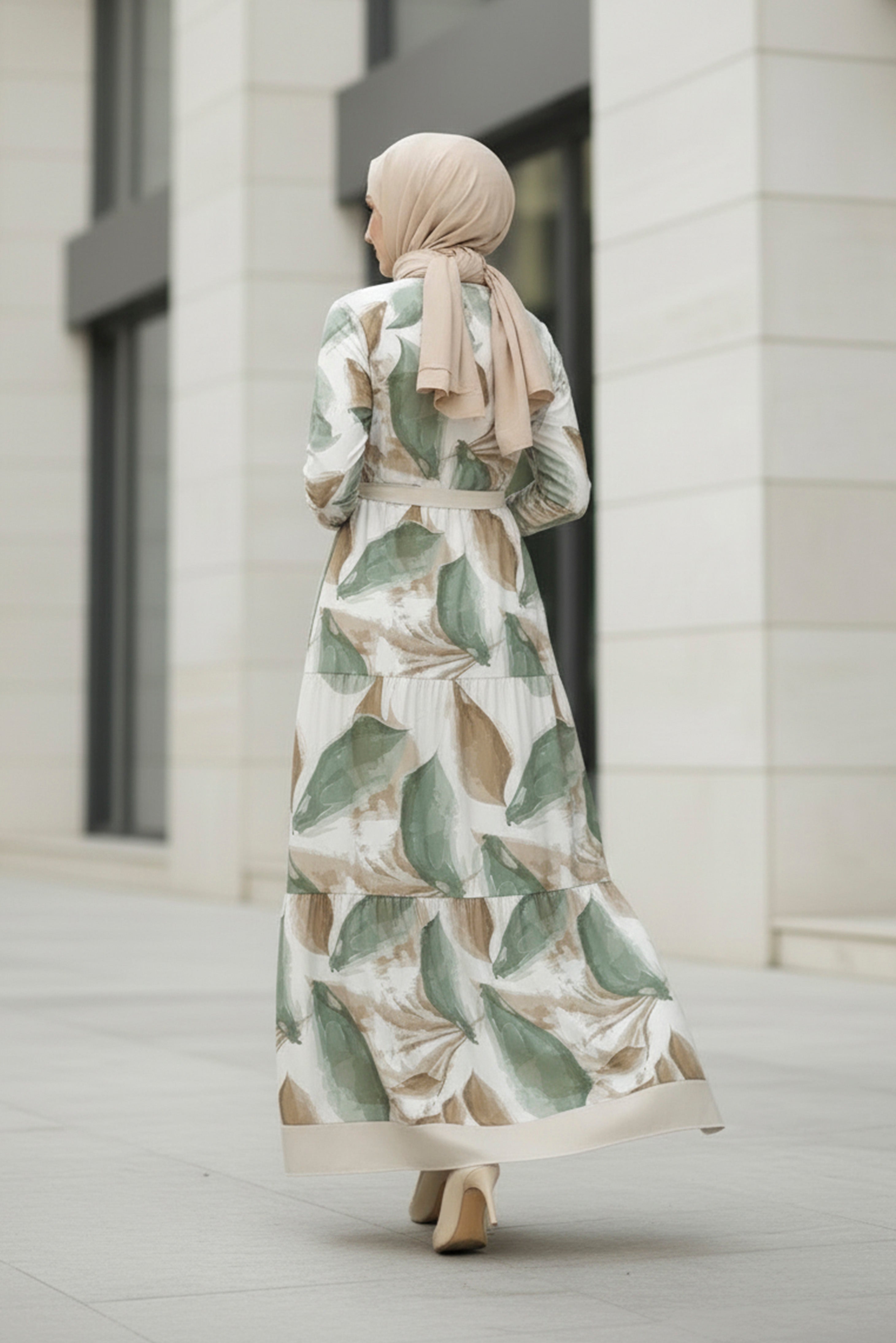 Back view of sage leaf modest maxi dress with botanical print and long sleeves